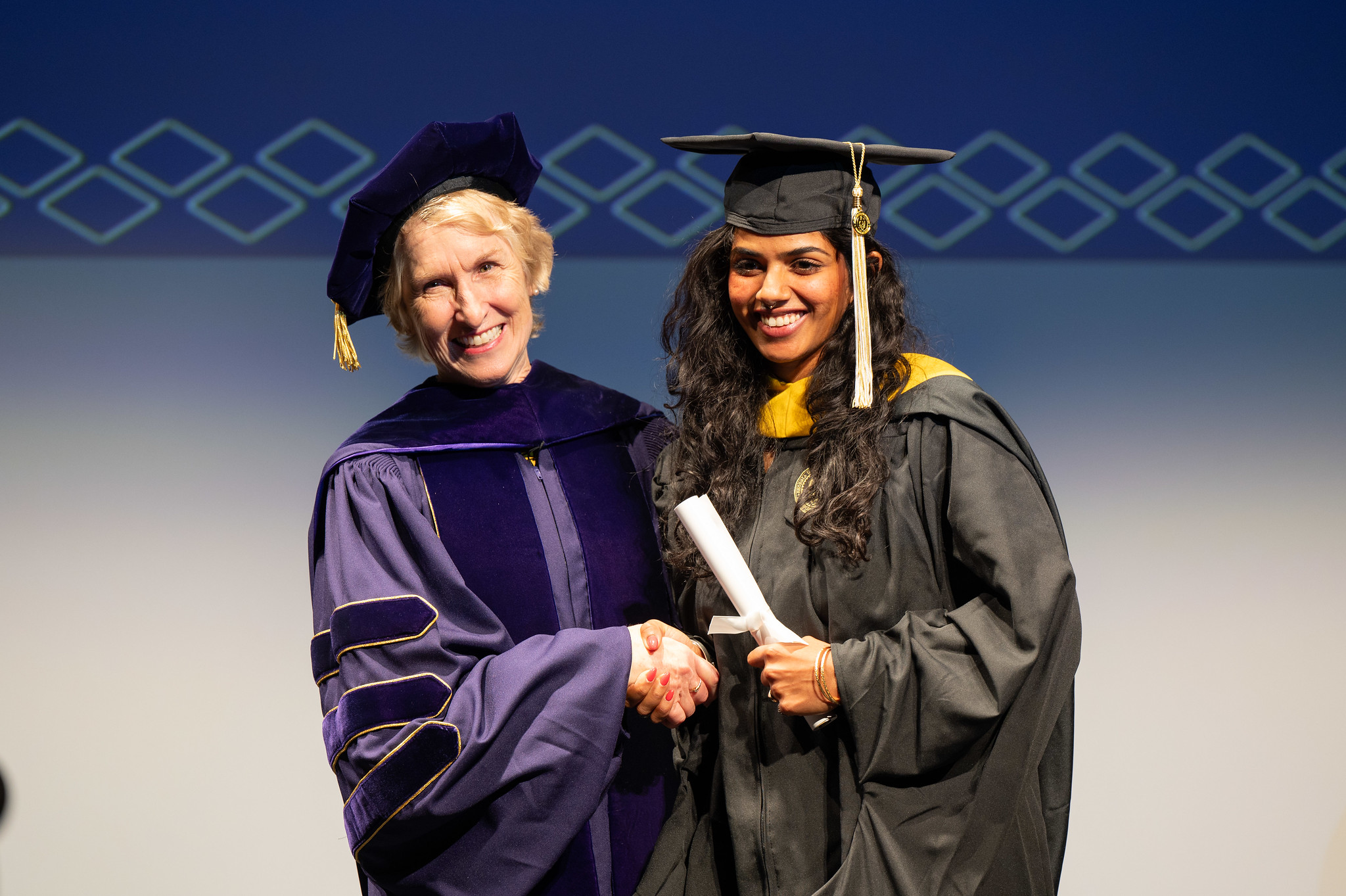Dean Lozier congratulates a newly minted College of Sciences alum.