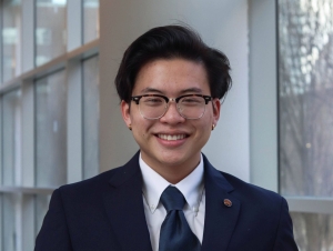 Elliot Huang will graduate in May with bachelor’s degrees in psychology and computer science. Elliot Huang is wearing a suit for this headshot