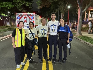 EMS at Tech members provide medical support during campus events like Halloweekend. Students stand in front of an ambulance.