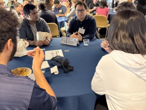 Chris Kwan (Mathematics 2019) leads a discussion about optimizing a science degree in the job search. A group sits around a round table