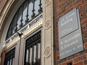 The School of Psychological and Brain Sciences is located in the J.S. Coon Building. Wrought iron covered front doors of the J.S. Coon Building