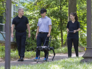 Georgia Tech researchers test their prototype of a robotic guide dog. Photo by Terence Rushin/College of Computing.